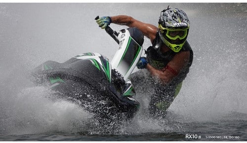 Sony RX10 IV captures a jet ski rider in action, showcasing speed and water splashes. Dynamic shot, perfect for watersport enthusiasts.