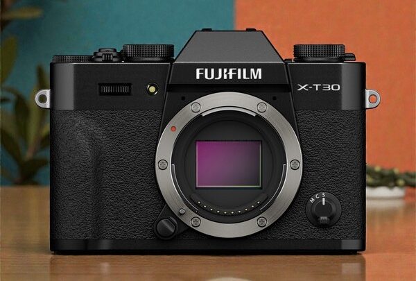 Fujifilm X-T30 III face. Black mirrorless camera with silver lens mount for photography enthusiasts.