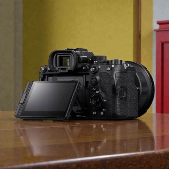 Sony A7 V camera side view showing the articulating screen, controls, and lens. High-quality full-frame mirrorless camera.